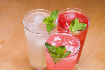 Three various summer milkshakes in glasses