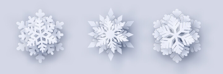 Vector set of 3 white Christmas paper cut 3d snowflakes with shadow on white background. New year and Christmas design elements