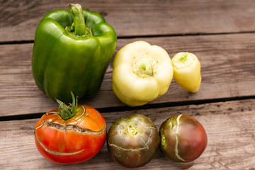 fresh tomato and pepper on a wooden background