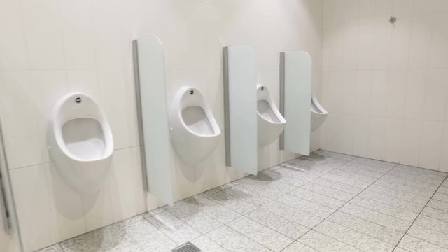 Urinals and toilet cubicles. Dolly video