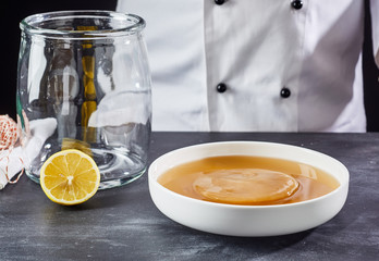 Starter liquid with scoby and sterilised glass jar