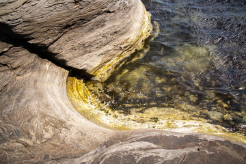 Part of a coastal sea stone wall.