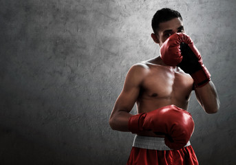 Fototapeta na wymiar Strong muscular boxer