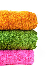 Bath towels in a pile on a white background