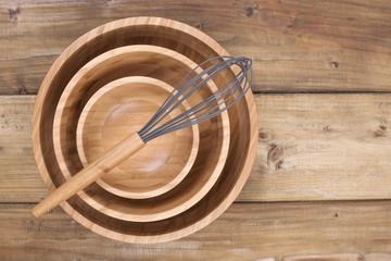 identical wooden plates of different sizes, corolla for cooking on a wooden background. Natural materials at home and in the kitchen. Copy space,