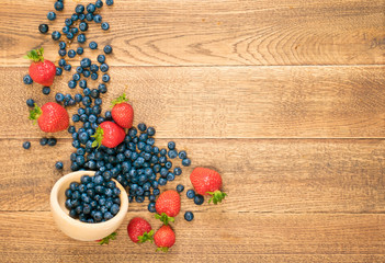 Fresh Berries on Rustic Wooden Background
