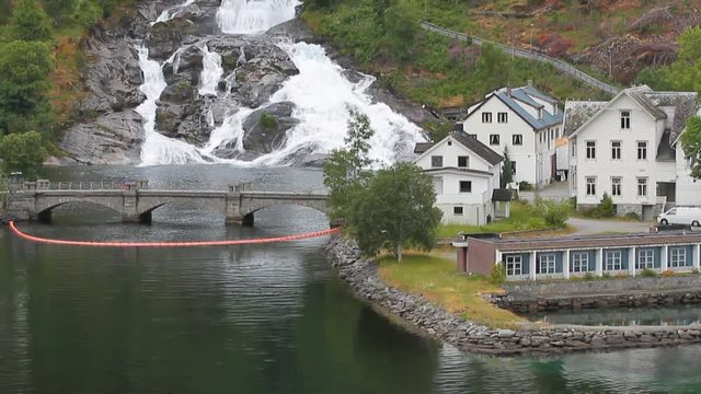 Bridge, settlement and falls on hillside. Hellesylt, Norway