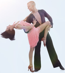 beautiful ballroom dance couple in a dance pose isolated on white