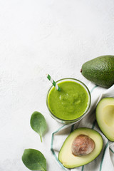 Avocado and spinach smoothie in glass