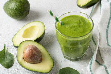 Avocado and spinach smoothie in glass
