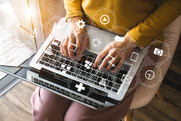 Coding software developer work with augmented reality dashboard computer icons  with responsive cybersecurity.Businessman hand working.