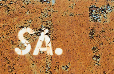 Dark Rusted Metal Texture Background with SA Letters