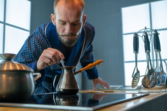 Elderly Man Sniffing Coffee In Brass Turkey