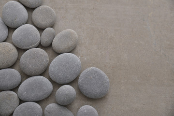 Fototapeta na wymiar Pile of gray stones on gray background