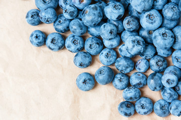 Fresh blueberry on craft paper background. Blueberries texture close up