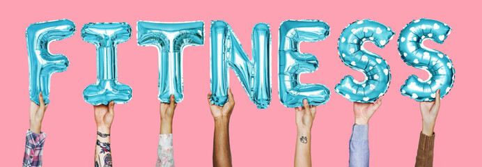 Hands showing fitness balloons word