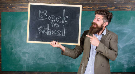 Hiring teachers for new school year. Man bearded holds blackboard inscription back to school. Back to school teachers recruitment. Looking committed teacher complement qualified workforce educators