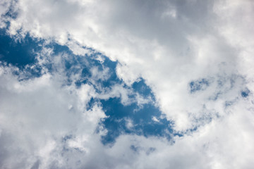 Bright blue sky with white clouds, sky after the storm with storm clouds