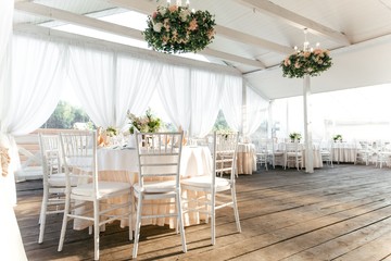 Empty summer restaurant with round tables