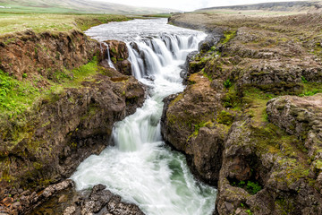 Fototapeta na wymiar Long exposure smooth water waterfall Kolufossar Falls in Iceland, canyon Kolugljufur gorge landscape view