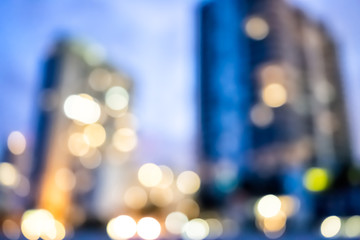 Sunny Isles Beach, apartment condo hotel buildings during dark evening night blue hour illuminated in Miami, Florida with skyscrapers abstract bokeh background circles