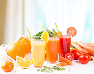 Fresh juices, Orange, Carrot, Apple, Tomato drinks with fruits and vegetables on wooden table. 