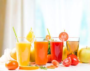 Fresh juices, Orange, Carrot, Apple, Tomato drinks with fruits and vegetables on wooden table. 