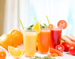 Fresh juices, Orange, Carrot, Apple, Tomato drinks with fruits and vegetables on wooden table. 