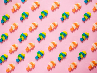Jelly candies fish pattern on pink background
