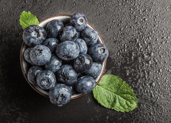 blueberry with mint on a stone background slate
