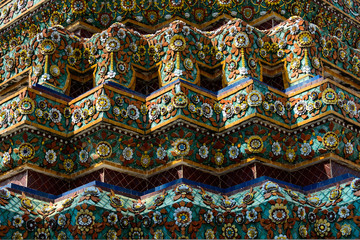 Close up beauitful mosaic tiles of large stupas in Wat Pho or Wat Phra Chetuphon Vimolmangklararm Rajwaramahaviharn is one of Bangkok's oldest temples, THAILAND