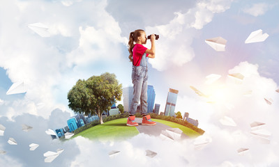 Concept of careless happy childhood with girl looking in future