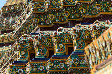 Close up beauitful mosaic tiles of large stupas in Wat Pho or Wat Phra Chetuphon Vimolmangklararm Rajwaramahaviharn is one of Bangkok's oldest temples, THAILAND