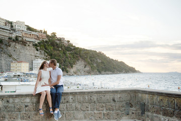 Young smiling tender romantic couple in Sorrento, Italy - love concept
