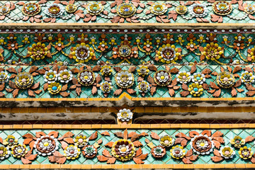 Close up beauitful mosaic tiles of large stupas in Wat Pho or Wat Phra Chetuphon Vimolmangklararm Rajwaramahaviharn is one of Bangkok's oldest temples, THAILAND