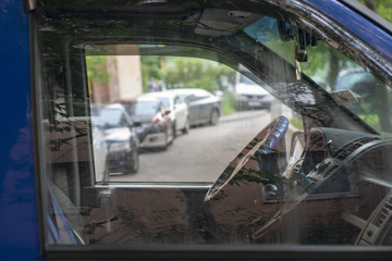 Fototapeta premium View through the window of the car on the interior and street