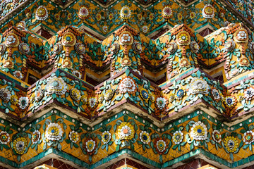 Fototapeta na wymiar Close up beauitful mosaic tiles of large stupas in Wat Pho or Wat Phra Chetuphon Vimolmangklararm Rajwaramahaviharn is one of Bangkok's oldest temples, THAILAND