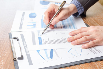 business man analyzing graph and chart document report
