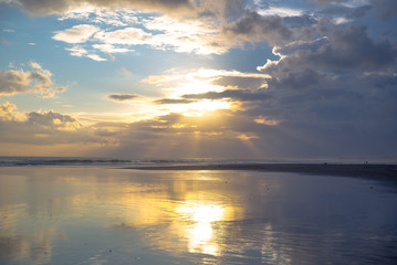 Panarama of the beautiful sunset on the ocean with cloudy sky