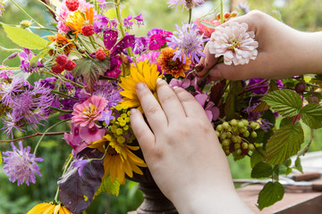 Florist hands make a wedding bouquet