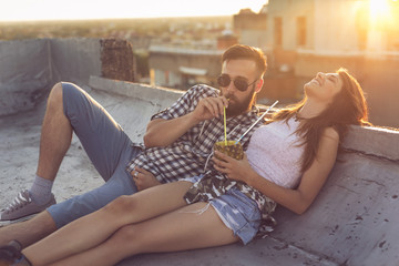 Couple enjoying summertime rooftop party