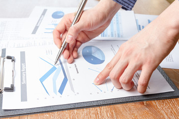 business man analyzing graph and chart document report