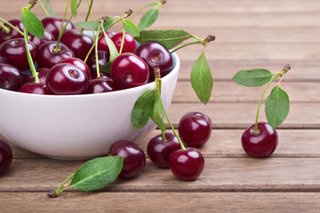 White plate of ripe cherries