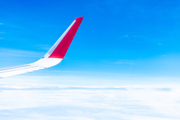 blue sky and white cloud with wing view from airplane - travel concept