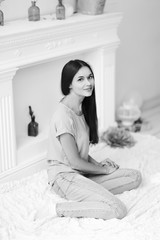 close up.young girl sitting on floor in living room