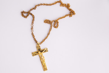 golden crucifix in colorful background