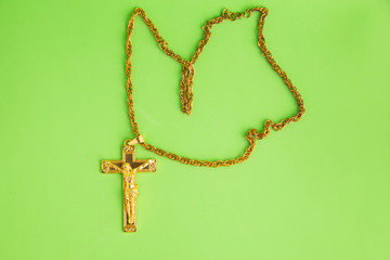 golden crucifix in colorful background