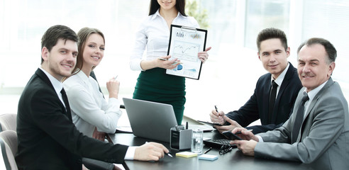 young business woman in a business meeting with the business team