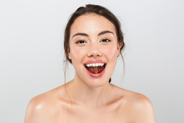 Beauty portrait of a cheerful young topless woman