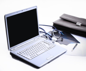 closeup. laptop and stethoscope in the workplace therapist